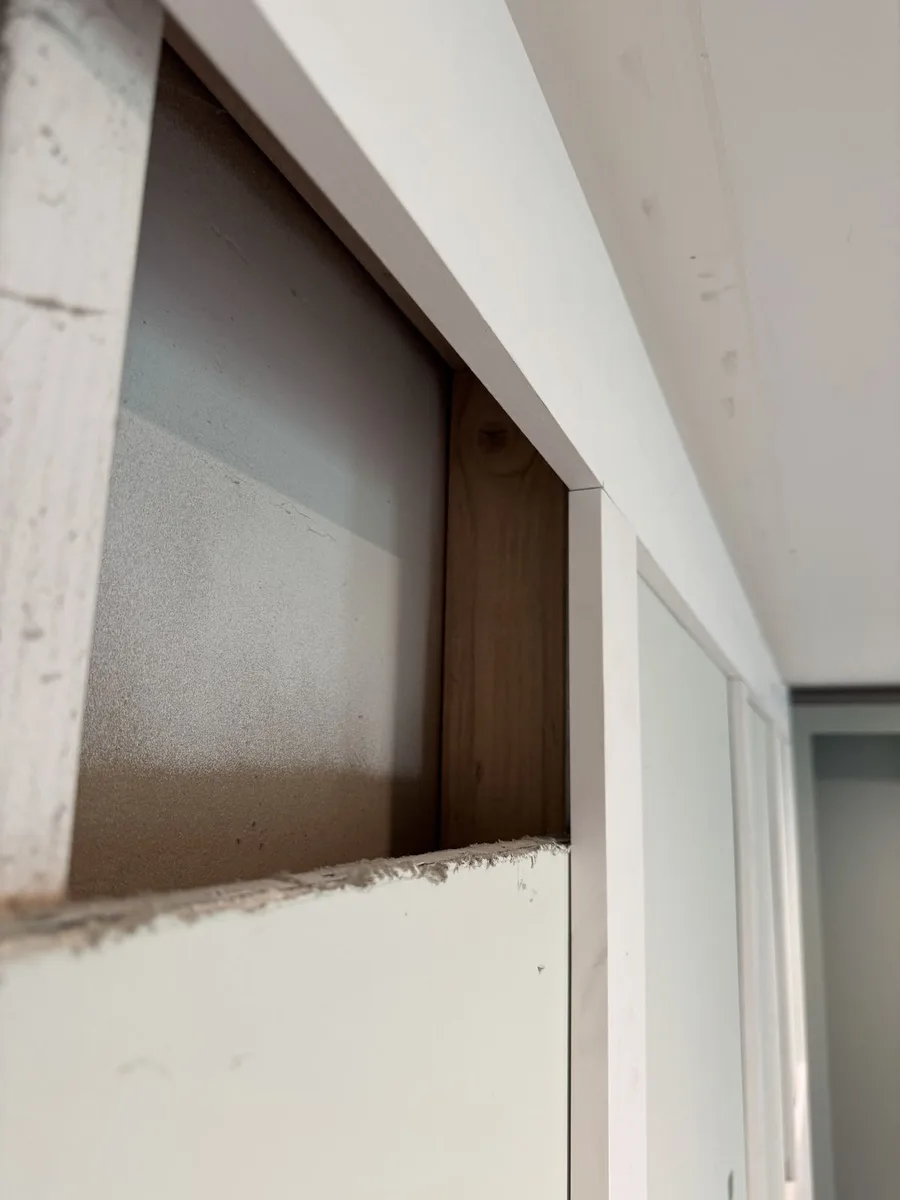 White MDF wall panels with crown moulding, custom built-in look, Newtown Square