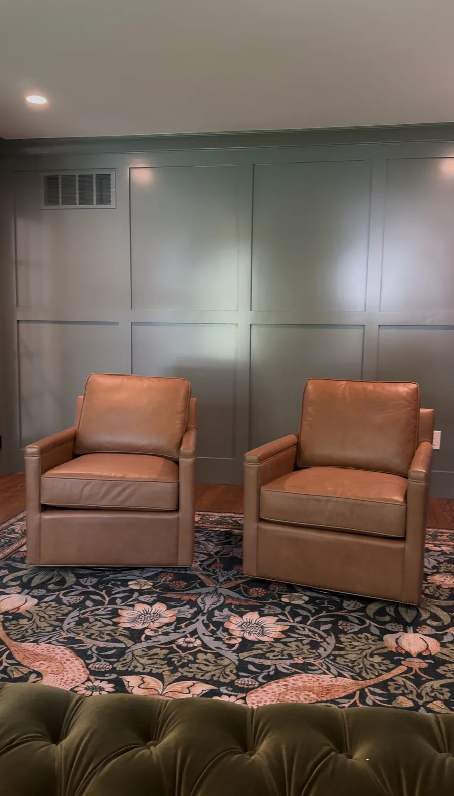 Two leather armchairs in front of completed panel wall, Newtown Square family room